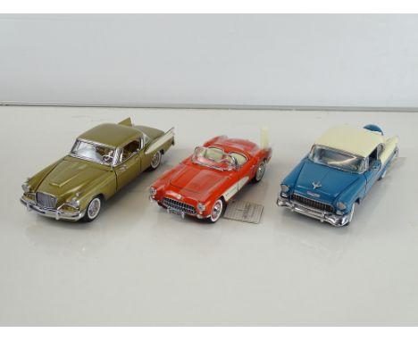 A group of diecast cars in 1:24 Scale by FRANKLIN and DANBURY MINTS: comprising a 1957 Corvette Fiberglass Edition, a 1957 St