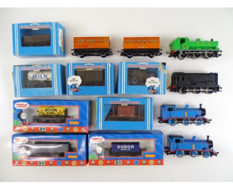 A mixed group of Thomas the Tank Engine series locos and rolling stock to include 4 unboxed engines and various wagons and co