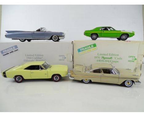 A group of diecast cars in 1:24 Scale by DANBURY MINT: comprising a 1960 Cadillac Eldorado Biarritz, a 1970 Plymouth 'Cuda, a