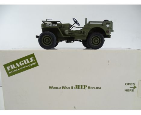 A 1:16 scale DANBURY MINT World War II Jeep replica - VG with all accessories unused in G/VG box