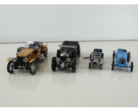 A group of diecast cars in 1:24 Scale by FRANKLIN MINT: comprising a 1921 Rolls Royce Silver Ghost with copper body, a 1924 B