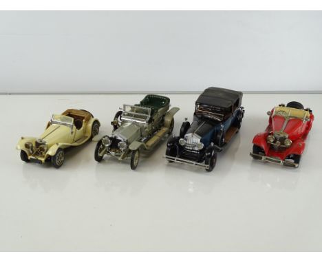 A group of diecast cars in 1:24 Scale by FRANKLIN MINT: comprising a Jaguar SS-100, A Rolls Royce Silver Ghost, a 1929 Rolls 