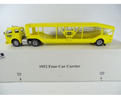 A 1:24 scale DANBURY MINT 1952 Four-Car Carrier - VG in G/VG box