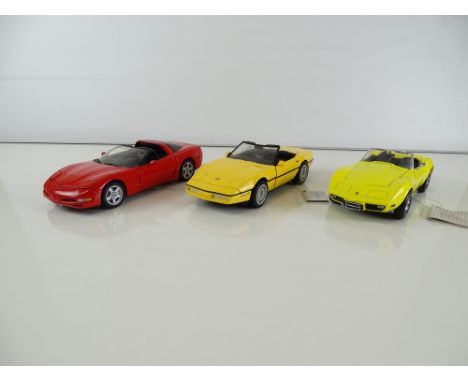 A group of diecast cars in 1:24 Scale by FRANKLIN MINT: comprising a 1997 Corvette, a 1986 Corvette and a 1975 Corvette L88 C