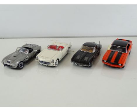 A group of diecast cars in 1:24 Scale by FRANKLIN MINT: comprising a Shelby Cobra 427 S/C, a 1969 Camaro Z/28, a 1953 Chevrol