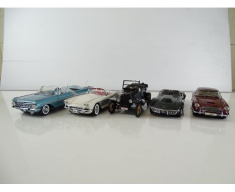 A group of diecast cars in 1:24 Scale by DANBURY MINT: comprising a 1959 Chevrolet Impala Convertible, a 1961 Chevrolet Corve