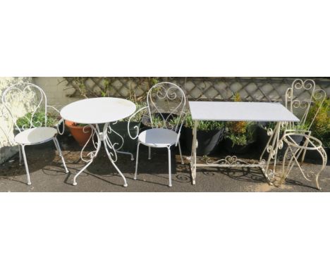 A circular patio table with two chairs, A vintage wrought iron table and chair (5) Condition Report: Available upon request