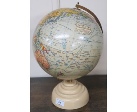 A Geographia 10 inch terrestrial globe Condition Report: Globe is in a condition consummate with its age and use there are so