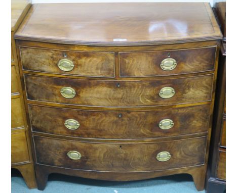 A two over three bow front walnut chest on bracket feet with brass handles, 103cm high x 102cm wide x 51cm deep Condition Rep