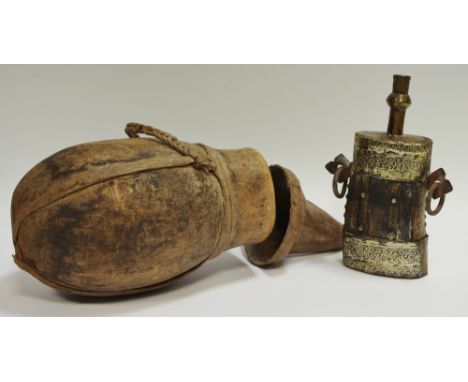 A tribal gourd water vessel and cover; a late 19th/early 20th century Indian powder flask, white metal mounts (2) 