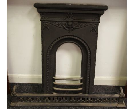 A Victorian cast iron bedroom fire surround; a cast metal fender (2)