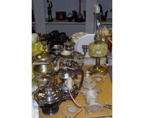 An early 20th century brass oil lamp, a yellow & white mottled glass oil reservoir; various three branch candelabra; a spirit