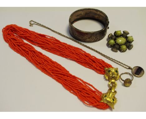 A Blue John oval pendant, on chain; a Blue John ring; a coral choker with gilded Cartier style tiger mask clasp; Scottish bro