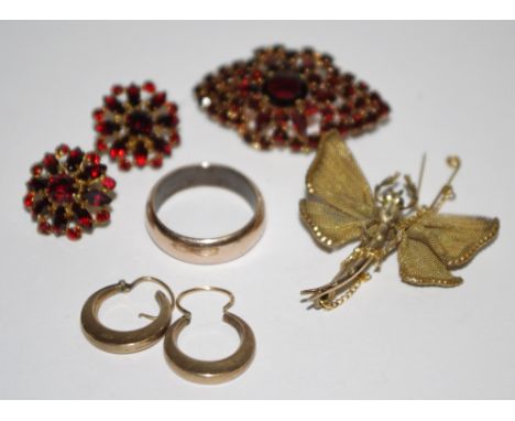 A rose coloured half barrel wedding ring; a pair of 9ct gold hoop earrings; a yellow metal brooch in the form of a butterfly;