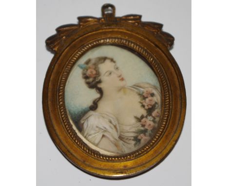 French School, 19th century, a portrait miniature, lady with roses in her hair and floral garland, watercolour on ivory, 6cm 