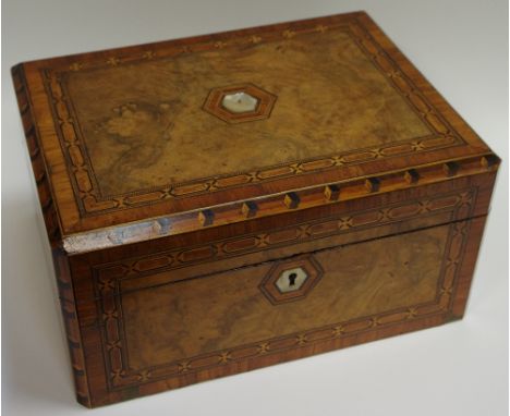 A Victorian walnut and marquetry writing slope, mother of pearl cartouche opening to velvet lined writing service, ink bottle