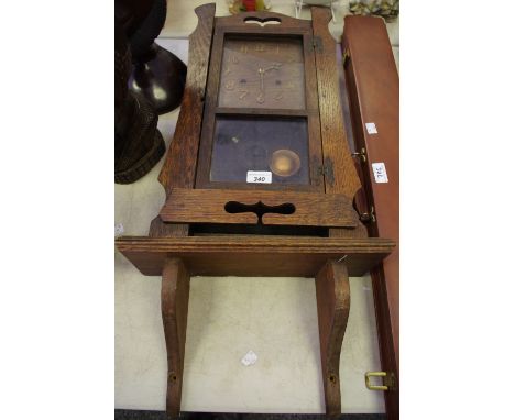 An oak bracket clock and bracket, c.1930