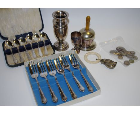 A silver baluster shaped spill vase, Chester, 1922; a cased set of 6 silver spoons; an EPNS bell, a teething ring with a EPNS