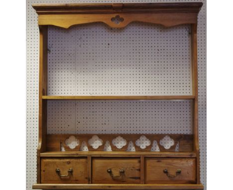 A farmhouse pine hanging open shelf unit with three drawers