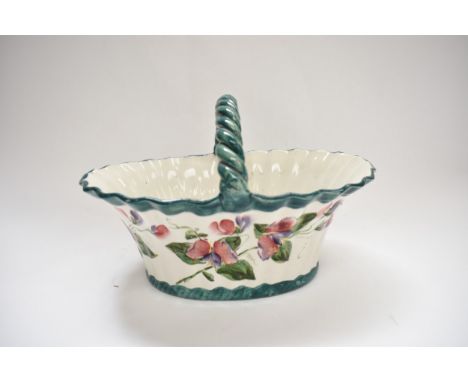 A Wemyss basket decorated in 'Sweet Pea' pattern, retailed by T.Goode, 20cm tall, 29cm long, 21cm wide