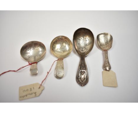 Three silver tea caddy spoons with engraved decoration including Thomas Dones, Birmingham 1852, Christopher &amp; Thomas Wilk