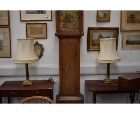 A pair of brass column form lamps, 76cm tall with shade
