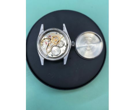 ROLEX: A circa 1965 stainless steel cased Rolex 'Oysterdate Precision' wristwatch, silvered dial with raised arrowhead and ba