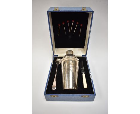 A presentation cocktail set in case.  The cocktail shaker engraved with inscription to H.A. Skinner Esq on his retirement 31s
