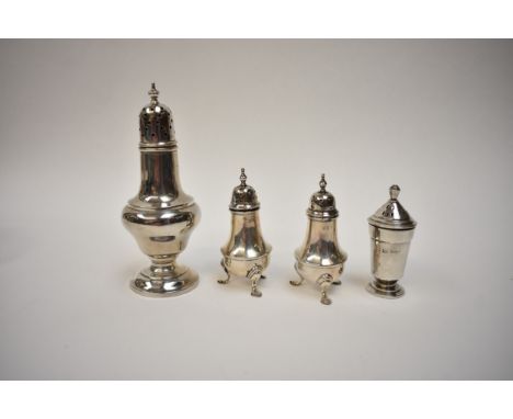 A silver castor with filled base, pair of silver pepperettes and a single silver pepperette (4), 187.6g
