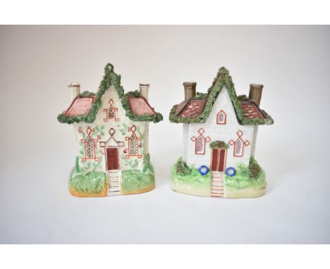 A Staffordshire cottage and similar porcelain example with blue circular crown mark to base.  13cm x 10.5cm and 12.5cm x 10.5