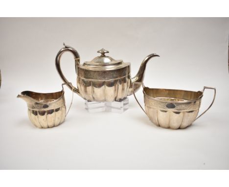 An Edinburgh George III, Francis Howden three piece silver tea set with thistle decorative band, monogram to cartouche, ivory