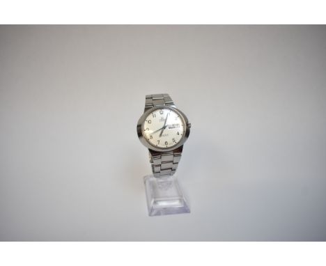 An Omega Geneve Dynamic stainless steel cased wristwatch, silvered dial with blue centre seconds hand, day/date aperture, in 