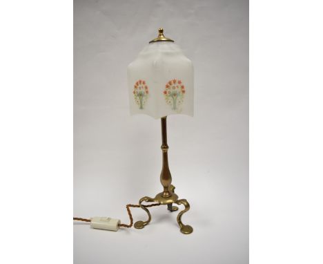 A vintage brass table lamp with opaque glass shade decorated with flowers, 44cm tall
