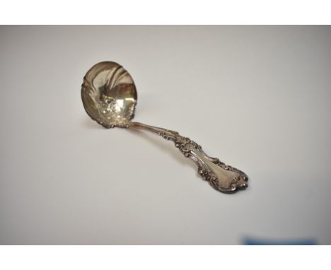 A sterling silver fancy sauce ladle, 16cm long.  91g