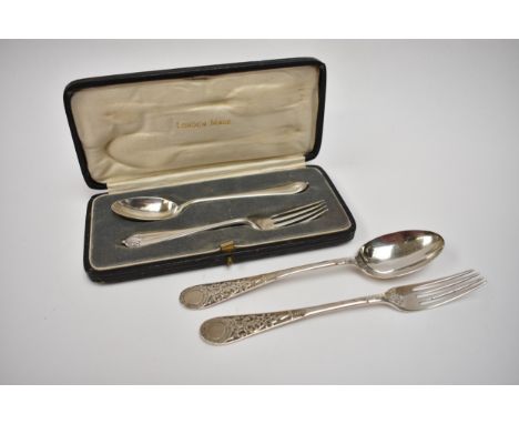 A cased silver christening fork and spoon set, maker R S &amp; S, London 1921 and a Victorian uncased example by Martin Hall 