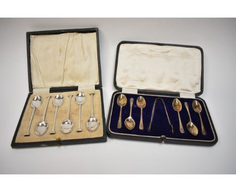 Two cased sets of silver coffee spoons including James Dixon &amp; Sons with lion mask terminals, Sheffield 1927 and Henry Cl