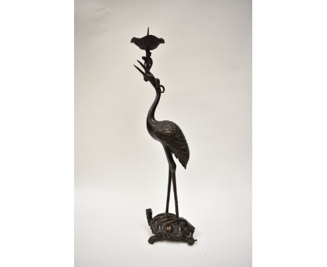A Japanese bronze sculptural candlestick in the form of a crane on a tortoise, one leg not fully joined see image , 50.5cm hi