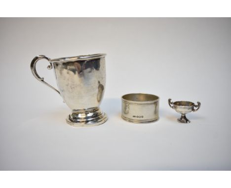 A Sanders &amp; Mackenzie silver christening mug monogrammed and dated 1948, assayed London 1945, napkin ring and miniature t
