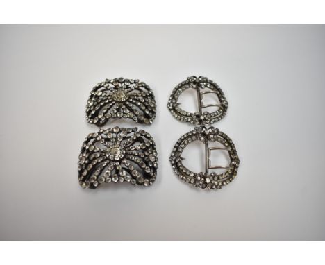 Two pairs of Georgian paste set buckles, one set with bow detail the other of floral form, two small stones missing to the la