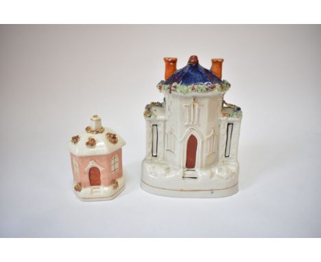 Two Victorian Staffordshire money boxes including cobalt blue roofed house and hexagonal cottage which has cracks present.  1