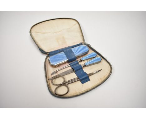 A Mappin &amp; Webb cased early 20th Century blue guilloche manicure set, some damage present, Birmingham 1937