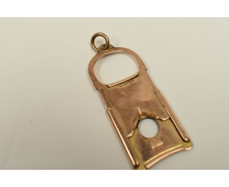 A 9ct gold Gourdel Vales &amp; Co cigar cutter, 5.5cm long, 2.5cm wide, 0.8cm diameter hole 7.92g