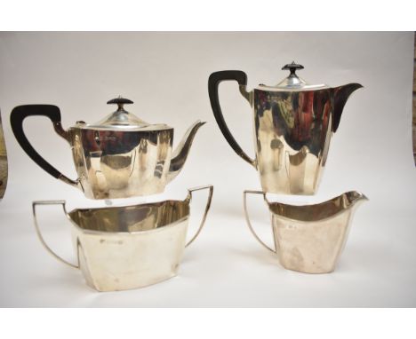 A Barker Brothers Silver Ltd four piece tea set with ebony knop and handles, Birmingham 1931, substantial dent to sugar bowl 