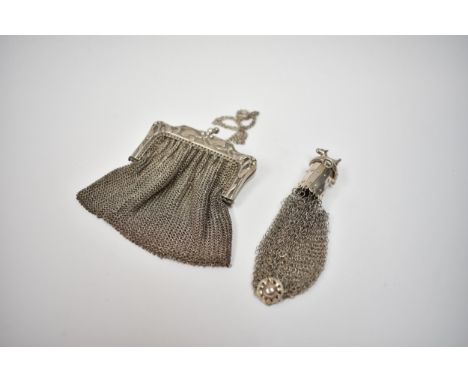 A chainmail evening purse with double compartment and miser's purse surmounted by a dog