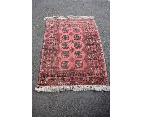 A small red rug, 145cm x 103cm