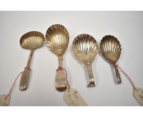 Four silver tea caddy spoons with shell form bowls including John Lias, London 1802, Chawner &amp; Co, London 1843 and Willia