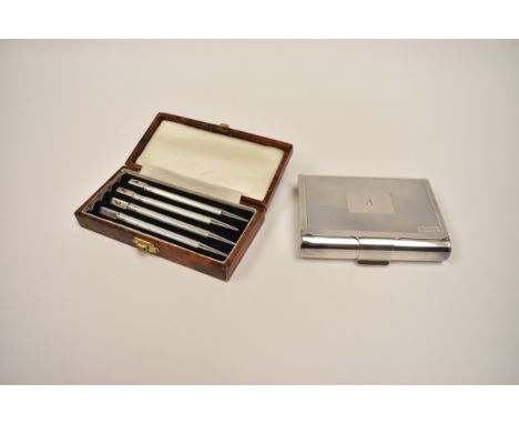 A cased set of sterling silver bridge pencils, enamel card suit motifs worn, and a silver business card holder makers mark TP