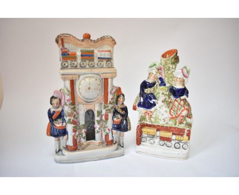Two circa 1850's Staffordshire figures celebrating the rapid expansion of rail travel, one possibly representing Euston Stati