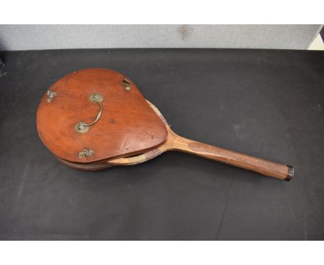 A mid 19th Century mahogany tennis racket holder and rackets