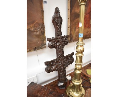 A carved oak cross decorated with a Stafford cross and Tudor roses, reputedly from Costessey Hall, 75cm tall x 32cm wide